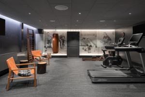 a gym with a treadmill and exercise equipment in a room at Solo Sokos Hotel Turun Seurahuone in Turku