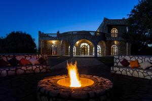 a fire pit in front of a house at Riad les trois merveilles in Essaouira +11 photos