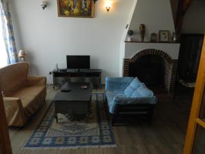 TV a/nebo společenská místnost v ubytování Casa Ligia