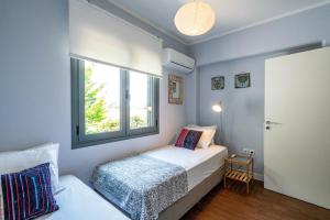 Posteľ alebo postele v izbe v ubytovaní Zen Villa in Schinias + 37 fotografií