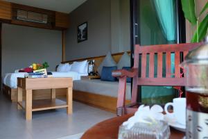 Ein Bett oder Betten in einem Zimmer der Unterkunft Koh Ma Beach Resort - SHA Extra Plus
