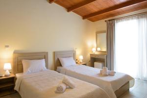 Postel nebo postele na pokoji v ubytování Ammoudara Beach Hotel Apartments + 37 fotografií