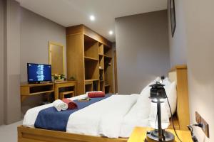 Ein Bett oder Betten in einem Zimmer der Unterkunft Koh Ma Beach Resort - SHA Extra Plus