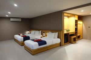 Ein Bett oder Betten in einem Zimmer der Unterkunft Koh Ma Beach Resort - SHA Extra Plus