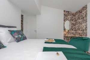 Postel nebo postele na pokoji v ubytování Apartments Strada Tučepi