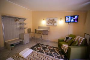 a living room with a couch and a table at B&B Trepo in Tropea