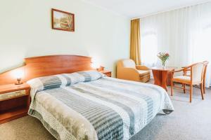 Postel nebo postele na pokoji v ubytování Hotel Gromada Toruń