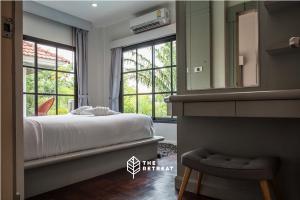 a bedroom with a bed and a mirror and a window at The Retreat Ao nang Private Pool Villa in Ao Nang Beach +37 photos