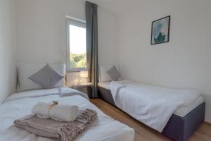 a bedroom with two beds and a window at Villa Croatica II in Šibenik +125 photos