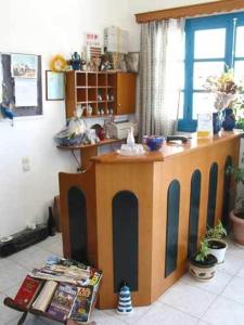 a room with a wooden counter in a room at Sunflower studios in Amoopi