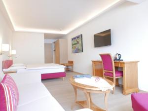 Posteľ alebo postele v izbe v ubytovaní ALPIN- Das Sporthotel, SUMMERCARD included May - September