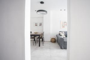 a living room with a couch and a table at Spacious Unique Luxurious Central in Thessaloniki