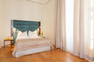 Posteľ alebo postele v izbe v ubytovaní HiLight Suites Hotel