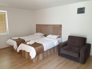 Ένα ή περισσότερα κρεβάτια σε δωμάτιο στο Hotel Cingo