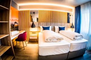 Postel nebo postele na pokoji v ubytování Hotel Wilder Mann