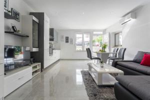 Kuchyň nebo kuchyňský kout v ubytování Apartments Amore