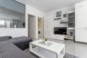 Kuchyň nebo kuchyňský kout v ubytování Apartments Amore