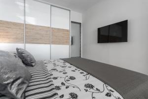 TV a/nebo společenská místnost v ubytování Apartments Amore