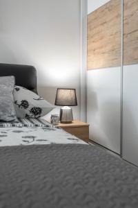 Postel nebo postele na pokoji v ubytování Apartments Amore
