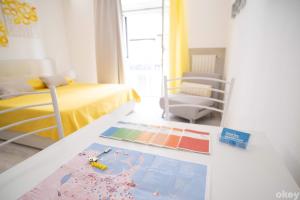 a bedroom with a bed and a table with a rug at Charme & Chic Studios - Bari Centro in Bari