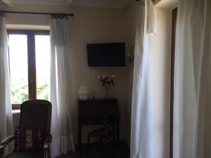 Telewizja i/lub zestaw kina domowego w obiekcie VILLA LE ROSE