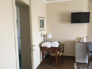 Telewizja i/lub zestaw kina domowego w obiekcie VILLA LE ROSE