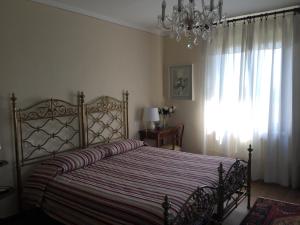 Łóżko lub łóżka w pokoju w obiekcie VILLA LE ROSE
