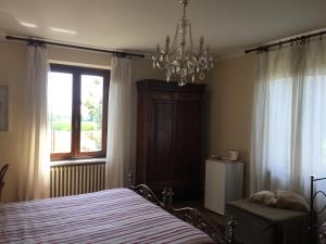 Łóżko lub łóżka w pokoju w obiekcie VILLA LE ROSE