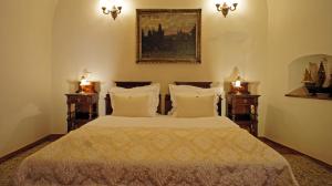 Postel nebo postele na pokoji v ubytování Grand Hotel Praha