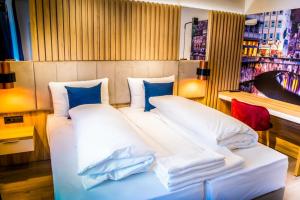 Postel nebo postele na pokoji v ubytování Hotel Wilder Mann