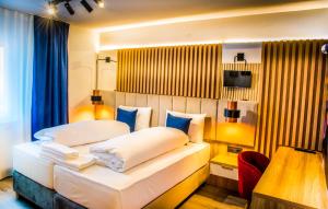 Кровать или кровати в номере Hotel Wilder Mann