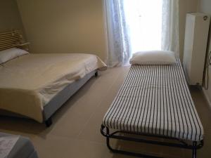 A bed or beds in a room at Myrto2 apartment
