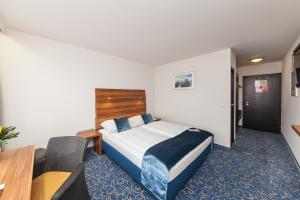 Voodi või voodid majutusasutuse Hotel Strohgäu toas