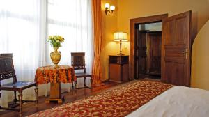 Postel nebo postele na pokoji v ubytování Grand Hotel Praha