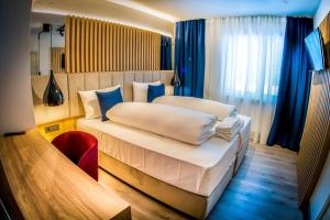 Postel nebo postele na pokoji v ubytování Hotel Wilder Mann