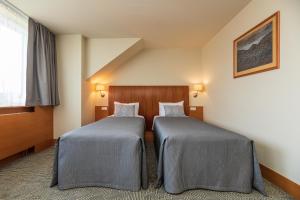
Voodi või voodid majutusasutuse Vanagupe Spa Resort toas
