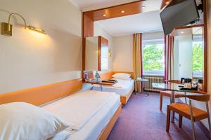 Lova arba lovos apgyvendinimo įstaigoje Best Western Raphael Hotel Altona