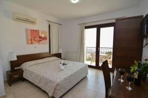 Postel nebo postele na pokoji v ubytování Palates Hotel