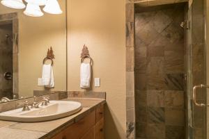 a bathroom with a sink and a shower at Moonlight Mountain Home-9 Indian Summer in Big Sky Mountain Village +37 photos