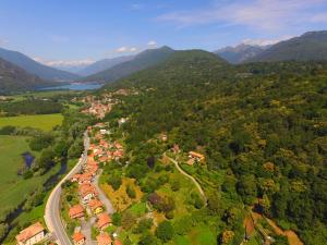 an aerial view of a town in a valley with mountains at B&B La Lanterna in Verbania