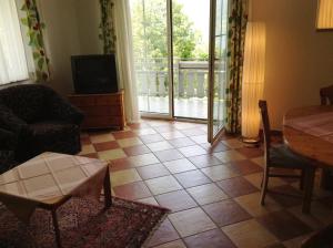 Predel za sedenje v nastanitvi Appartementhaus Karantanien am Ossiacher See + 33 fotografij