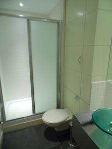 a bathroom with a toilet and a sink at Modern 2-bedroom Apt near SSE Hydro and SEC in Glasgow
