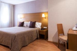 Postel nebo postele na pokoji v ubytování Hotel Don Paco