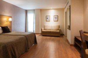 Postel nebo postele na pokoji v ubytování Hotel Don Paco