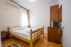 Postel nebo postele na pokoji v ubytování Guesthouse Dapcevic