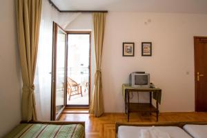 Postel nebo postele na pokoji v ubytování Guesthouse Dapcevic