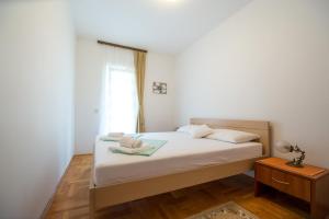Postel nebo postele na pokoji v ubytování Guesthouse Dapcevic