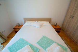 Postel nebo postele na pokoji v ubytování Guesthouse Dapcevic