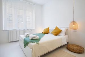 Postel nebo postele na pokoji v ubytování Twins Idola Apartments
