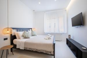 Postel nebo postele na pokoji v ubytování Twins Idola Apartments